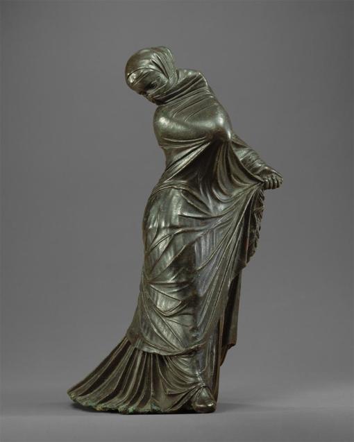 Bronze statuette of a veiled and masked dancer